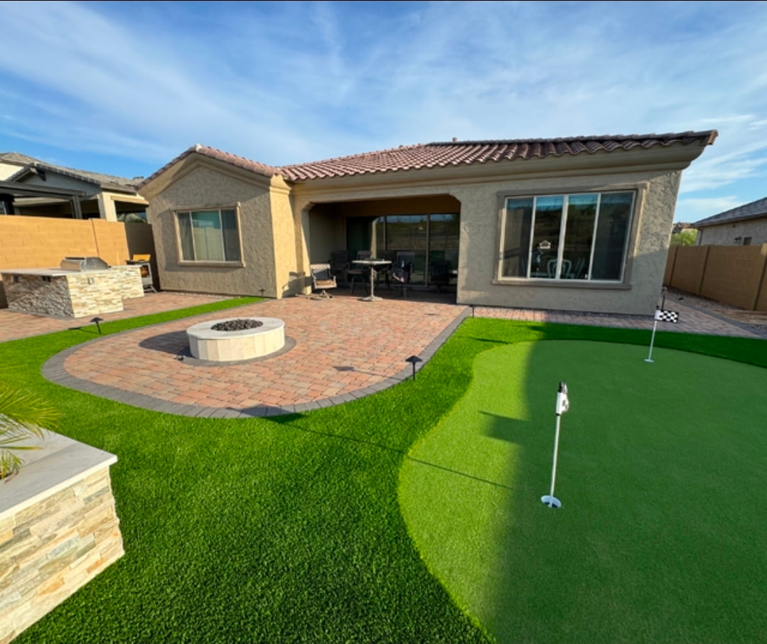 Greatview project with a paver patio, fire pit, artificial turf and putting green